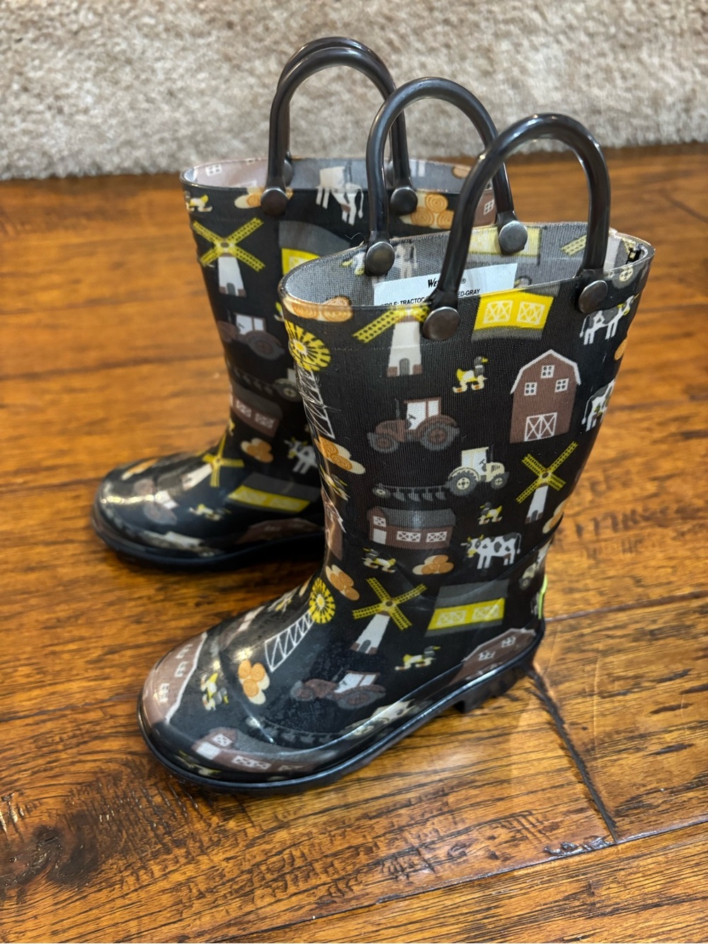 Western Chief Kids Tractor Barn Rain Boots in Black and Yellow